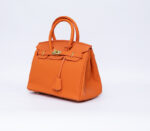 Hermes Kelly handbag in orange leather
