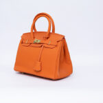Hermes Kelly handbag in orange leather