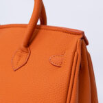 Hermes Kelly handbag in orange leather