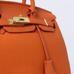 Hermes Kelly handbag in orange leather
