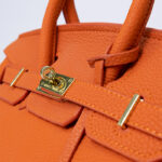 Hermes Kelly handbag in orange leather