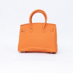 Hermes Kelly handbag in orange leather